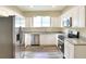 Modern kitchen features stainless steel appliances, white cabinets, and plenty of counter space for meal preparation at 1890 Martin Luther King, Jr. E Blvd, Bartow, FL 33830