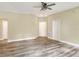 Spacious living room with new ceiling fan, wood-look flooring, and neutral walls, ready for personalization at 1890 Martin Luther King, Jr. E Blvd, Bartow, FL 33830