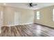 Bright and airy living room features modern flooring, neutral paint, a ceiling fan, and lots of natural light at 1890 Martin Luther King, Jr. E Blvd, Bartow, FL 33830