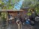 Image highlighting the backyard with a covered patio, shed, and outdoor storage at 216 Varnadoe Rd, Winter Haven, FL 33880