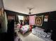 This bedroom features two beds and tapestries on the black wall at 216 Varnadoe Rd, Winter Haven, FL 33880