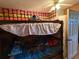 This bedroom features bunk beds and a door that leads outside at 216 Varnadoe Rd, Winter Haven, FL 33880