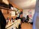 This bedroom features drawings on the wall and has a lot of items on the shelves at 216 Varnadoe Rd, Winter Haven, FL 33880