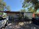 Exterior shot of a single-story home with a covered porch, showing condition of siding, and lawn at 216 Varnadoe Rd, Winter Haven, FL 33880