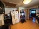 This kitchen features wood floors and includes a white refrigerator at 216 Varnadoe Rd, Winter Haven, FL 33880