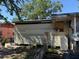 View of a home's side exterior displaying the yard, siding, and condition at 216 Varnadoe Rd, Winter Haven, FL 33880