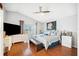 Well-lit bedroom with a ceiling fan, a patio door, and a full set of furniture at 217 Dillon Way, Davenport, FL 33897