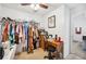 Bedroom with closet, desk, ceiling fan, and carpeted floors at 217 Dillon Way, Davenport, FL 33897