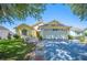 Charming single-story home with a well-manicured lawn, mature tree, and a two-car garage at 217 Dillon Way, Davenport, FL 33897