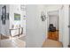 Hallway leads into a room featuring tile floors and neutral paint at 217 Dillon Way, Davenport, FL 33897