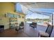 Enclosed patio featuring outdoor seating and view of the pool and backyard at 217 Dillon Way, Davenport, FL 33897