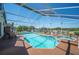 Screened-in pool with a spa and ample deck space for outdoor seating and lounging at 217 Dillon Way, Davenport, FL 33897