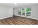 Well-lit bedroom featuring beautiful wood floors and large windows at 2400 Avenue D Sw, Winter Haven, FL 33880