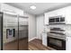 Modern kitchen featuring stainless steel appliances, subway tile backsplash, and granite countertops at 2400 Avenue D Sw, Winter Haven, FL 33880
