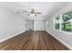 Bright living room featuring hardwood floors, a modern ceiling fan, and natural light at 2400 Avenue D Sw, Winter Haven, FL 33880