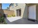 Private backyard features a concrete patio, sliding glass door and rear entrance door at 2500 21St Nw St # 78, Winter Haven, FL 33881