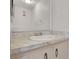 Bathroom vanity featuring marble countertops, a mirror, and cabinet at 2500 21St Nw St # 78, Winter Haven, FL 33881