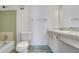 Bright bathroom featuring a toilet, shower, and vanity at 2500 21St Nw St # 78, Winter Haven, FL 33881