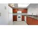 A kitchen featuring wood cabinets, granite countertops, and stainless steel appliances at 2500 21St Nw St # 78, Winter Haven, FL 33881