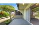 Covered patio overlooking mature landscaping and an adjacent screened enclosure at 2500 21St Nw St # 78, Winter Haven, FL 33881