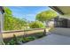 Outdoor patio with lush greenery and an eye-catching shade tree at 2500 21St Nw St # 78, Winter Haven, FL 33881