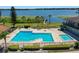 Aerial shot of the community's pool with a view of the lake and pier at 2500 21St Nw St # 78, Winter Haven, FL 33881