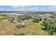 High angle aerial perspective of single Gathering home with a large lot in a mixed use area at 3728 Old Polk City Rd, Lakeland, FL 33809