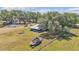Aerial shot of the home and property showing the boat, firepit, and other buildings at 3728 Old Polk City Rd, Lakeland, FL 33809
