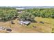Aerial of home and shed on a lot with mature trees and space for outdoor activities at 3728 Old Polk City Rd, Lakeland, FL 33809
