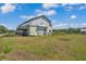 Rustic barn featuring weathered siding, a gabled roof, and plenty of potential at 3728 Old Polk City Rd, Lakeland, FL 33809