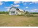 Rustic barn featuring weathered siding, a gabled roof, and plenty of potential at 3728 Old Polk City Rd, Lakeland, FL 33809