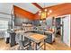 Modern kitchen with granite counters, stainless appliances, and cozy breakfast bar; stylish backsplash at 3728 Old Polk City Rd, Lakeland, FL 33809