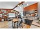 Open concept living room with wood paneling, exposed beams, and lots of natural light at 3728 Old Polk City Rd, Lakeland, FL 33809