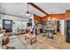 Open-concept living and kitchen space with stylish decor and comfortable seating; wood-paneled walls throughout at 3728 Old Polk City Rd, Lakeland, FL 33809