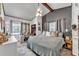 Cozy main bedroom with ample natural light, ceiling fan, and closet at 3728 Old Polk City Rd, Lakeland, FL 33809