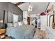 Cozy main bedroom with ample natural light, ceiling fan, and closet at 3728 Old Polk City Rd, Lakeland, FL 33809