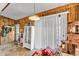 Bright sun room featuring wood paneling and white vertical blinds at 3728 Old Polk City Rd, Lakeland, FL 33809