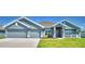 Charming single-story home with a three car garage, covered porch and well-maintained landscaping at 4027 Tullamore Ln, Auburndale, FL 33823