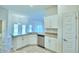Stylish kitchen with stainless steel appliances and granite countertops, providing ample cooking space at 4027 Tullamore Ln, Auburndale, FL 33823