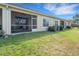 Nice backyard with lawn and screened in lanai at 4089 Shade Tree Ln, Lakeland, FL 33812