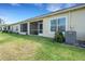 Nice backyard with lawn and screened lanai at 4089 Shade Tree Ln, Lakeland, FL 33812