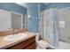 Bathroom with shower and tub combo with tile surround, plus a vanity sink at 4089 Shade Tree Ln, Lakeland, FL 33812