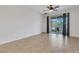 Spacious bedroom featuring tile floors, ceiling fan and sliding glass doors to lanai at 4089 Shade Tree Ln, Lakeland, FL 33812