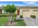 Charming single-Gathering home with a well-maintained lawn and a one car garage at 4089 Shade Tree Ln, Lakeland, FL 33812