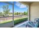 Relaxing screened lanai with chairs and view of the community at 4089 Shade Tree Ln, Lakeland, FL 33812