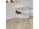 Open concept living and kitchen area with tile flooring and lots of natural light at 4089 Shade Tree Ln, Lakeland, FL 33812