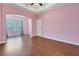 Bright living room with hardwood floors, tray ceiling, and an open layout perfect for entertaining at 4089 Shade Tree Ln, Lakeland, FL 33812