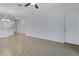 Open concept living area, featuring tile flooring and white walls with neutral paint at 4089 Shade Tree Ln, Lakeland, FL 33812