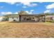 Spacious backyard featuring an enclosed screened in patio attached to the house at 435 Lyle Pkwy, Bartow, FL 33830