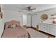 Bedroom includes cozy bed, dresser, and closet with a window offering warm natural light at 435 Lyle Pkwy, Bartow, FL 33830
